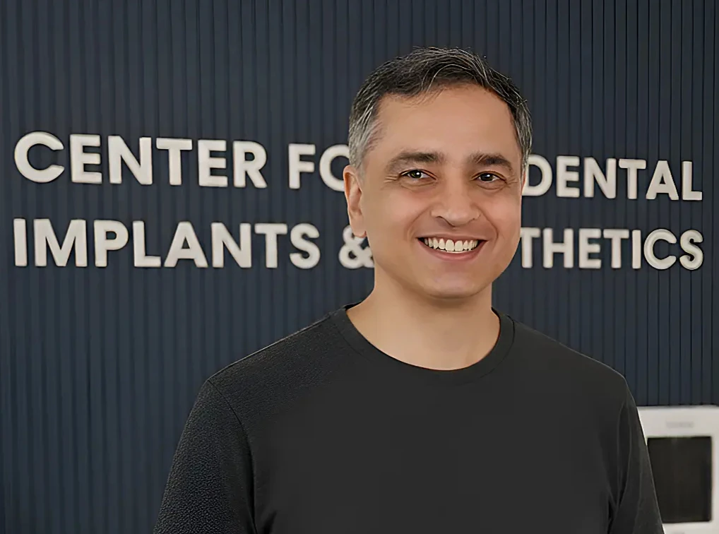 Patient smiling after dental implant - before and after result at CDIE Gurgaon