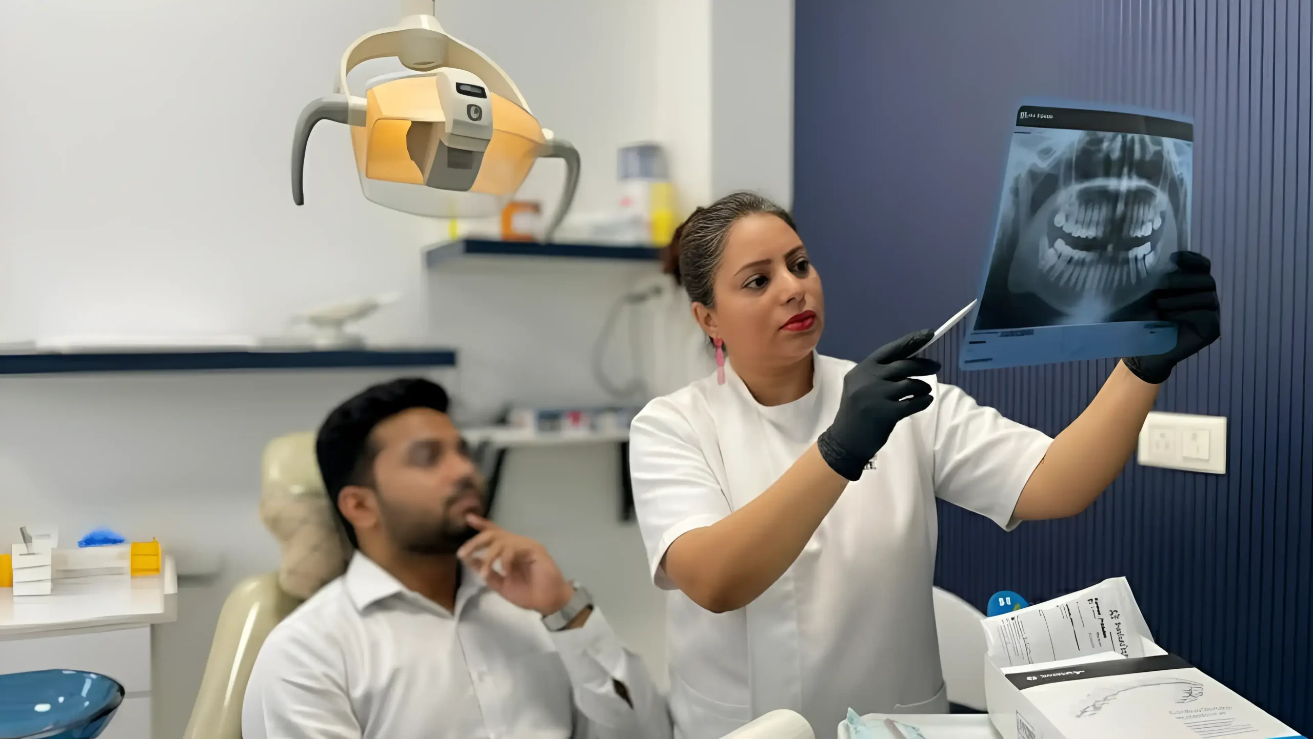 CDIE dental clinic interior - doctor in consultation with patient, Gurgaon